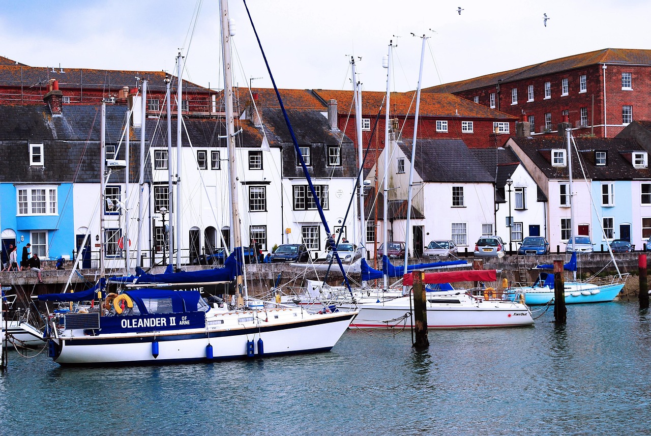 Calm harbour boats tied along a seaside town quay